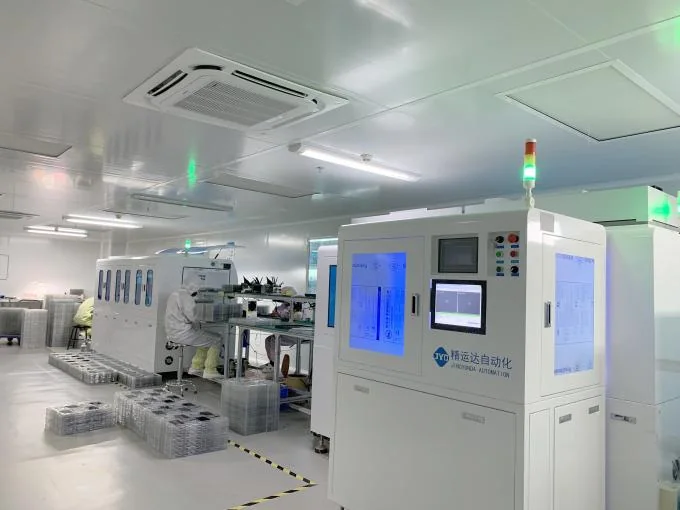 Automated inspection machine and loaded trays in the clean area