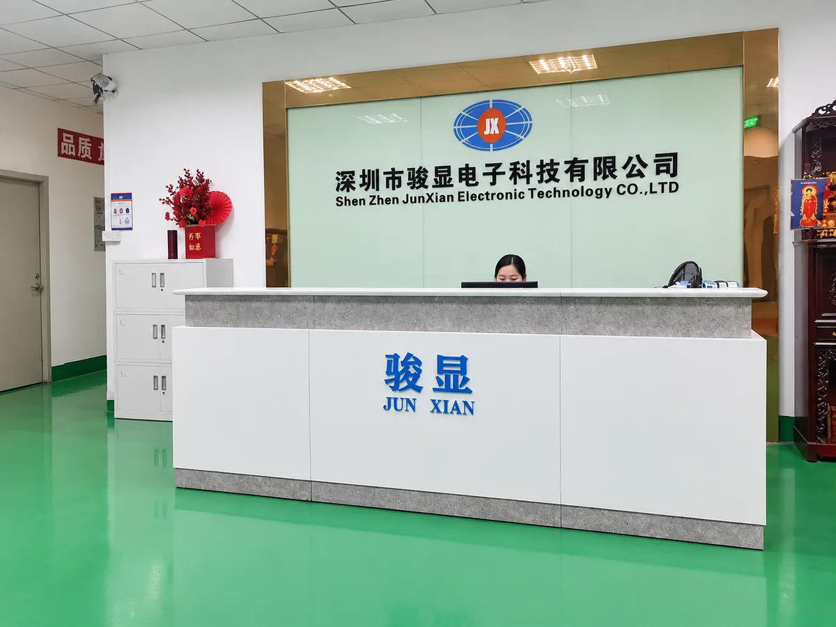 Junxian reception desk with the company name board